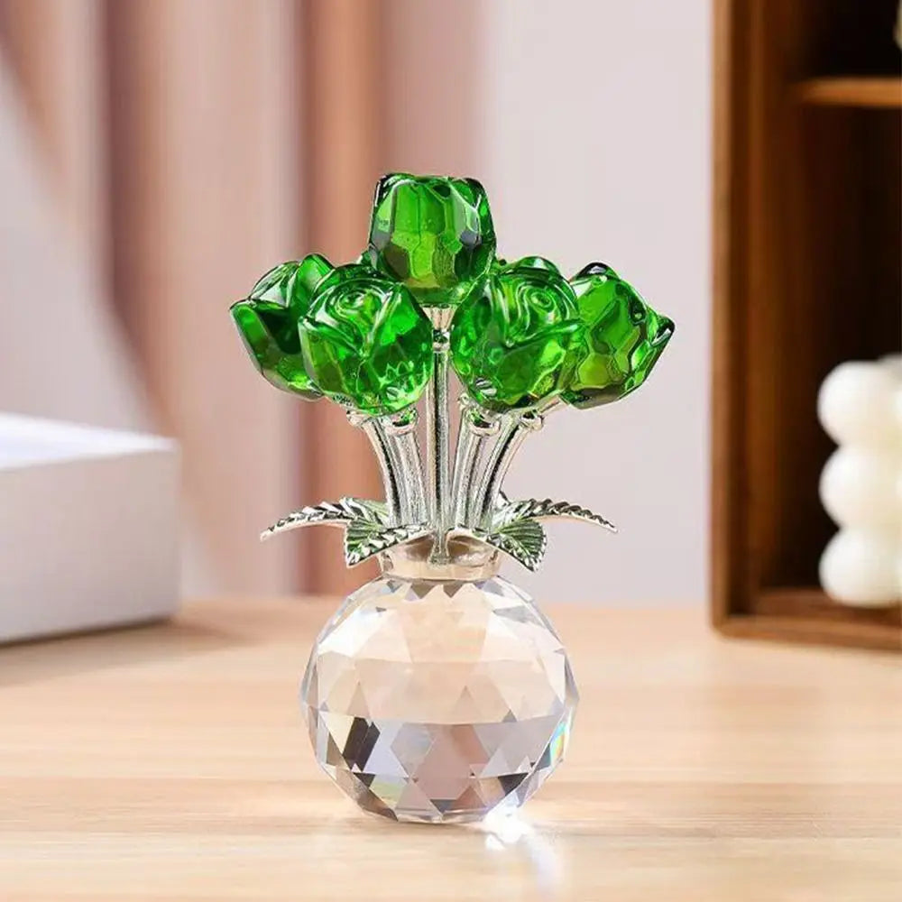 A crystal sculpture featuring a bouquet of green reflective roses displayed in a clear glass vase.