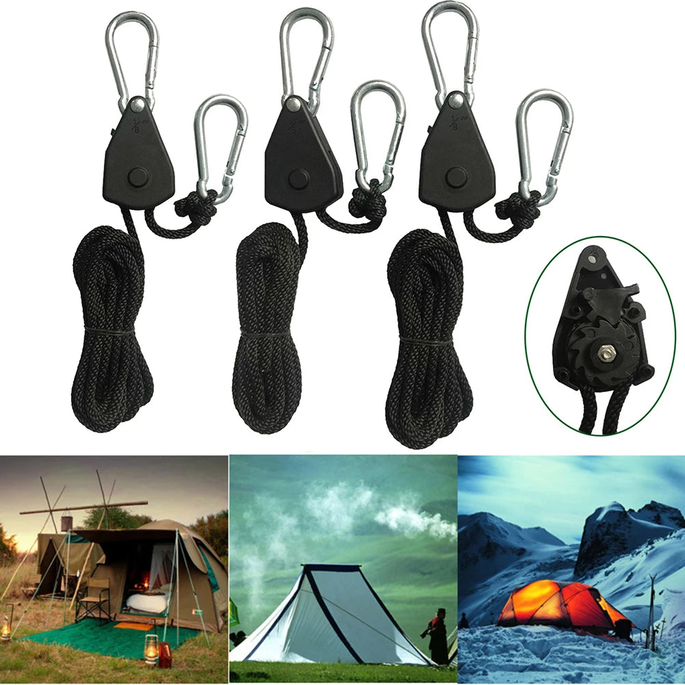 Three black rope tensioner hooks with ratchet pulleys shown alongside camping tents.