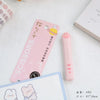 Pink portable scissors with a cat paw design and an ABS packaging card are shown on a white surface.