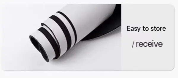 A roll of white and black diatomaceous earth bath mat with non-slip backing, shown diagonally.