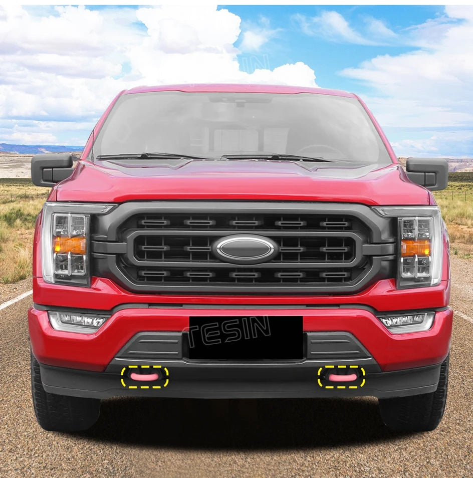 Red TPE front bumper tow hook cover for a Ford F-150 truck.