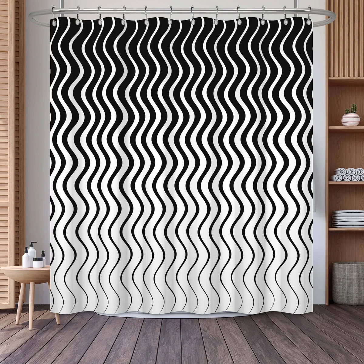 Black and white wavy stripe shower curtain hanging on a rod