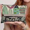 A canvas cosmetic bag featuring a vintage sardine print design with various fish shapes and decorative elements.