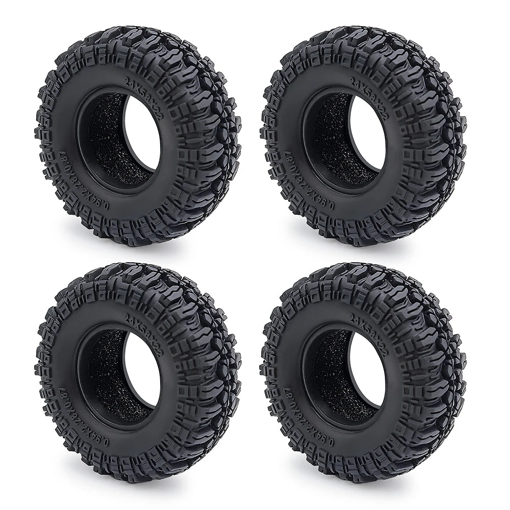 Two black soft rubber tires for 1/18 and 1/24 RC crawler cars shown from the top.