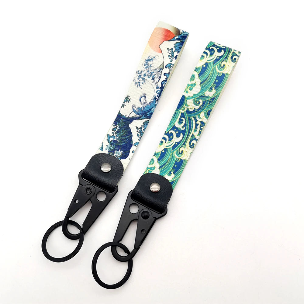 Hokkaido Wave JDM keychain featuring a Kanagawa surf design with blue and green patterns