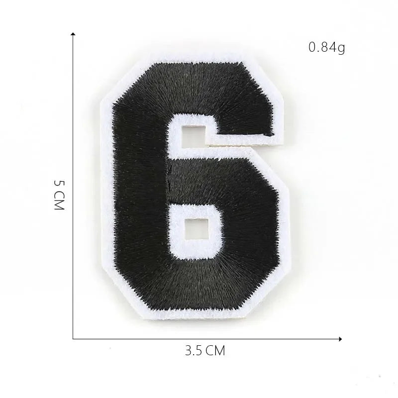 A black iron-on 3D number patch shaped like the numeral six, measuring 5 cm high and 3.5 cm wide.