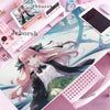 Pink anime girl illustration on a white mouse pad desk mat with a non-slip rubber base