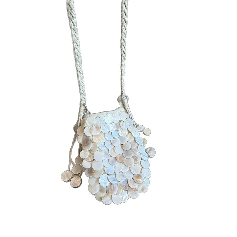 A light silver sequin accent chain shoulder bag with a delicate braided strap.