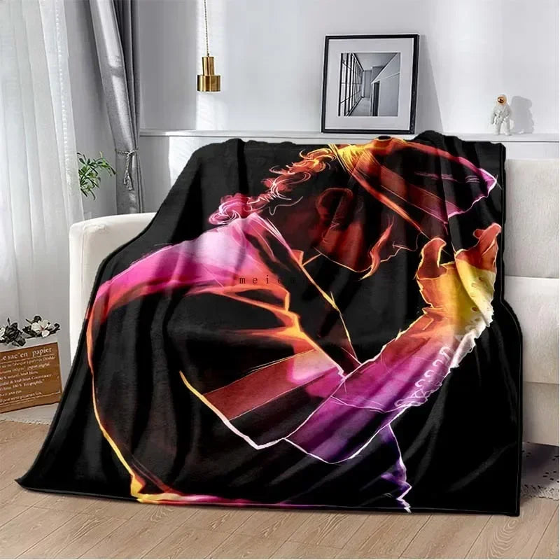 A black flannel throw blanket featuring a vibrant, artistic print of Michael Jackson.