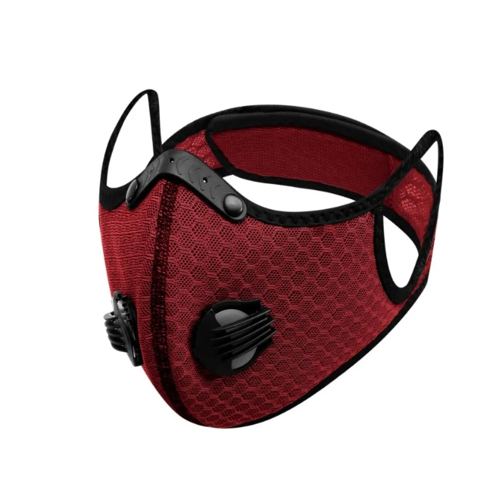 A maroon reusable dust mask with black accents and a mesh fabric.
