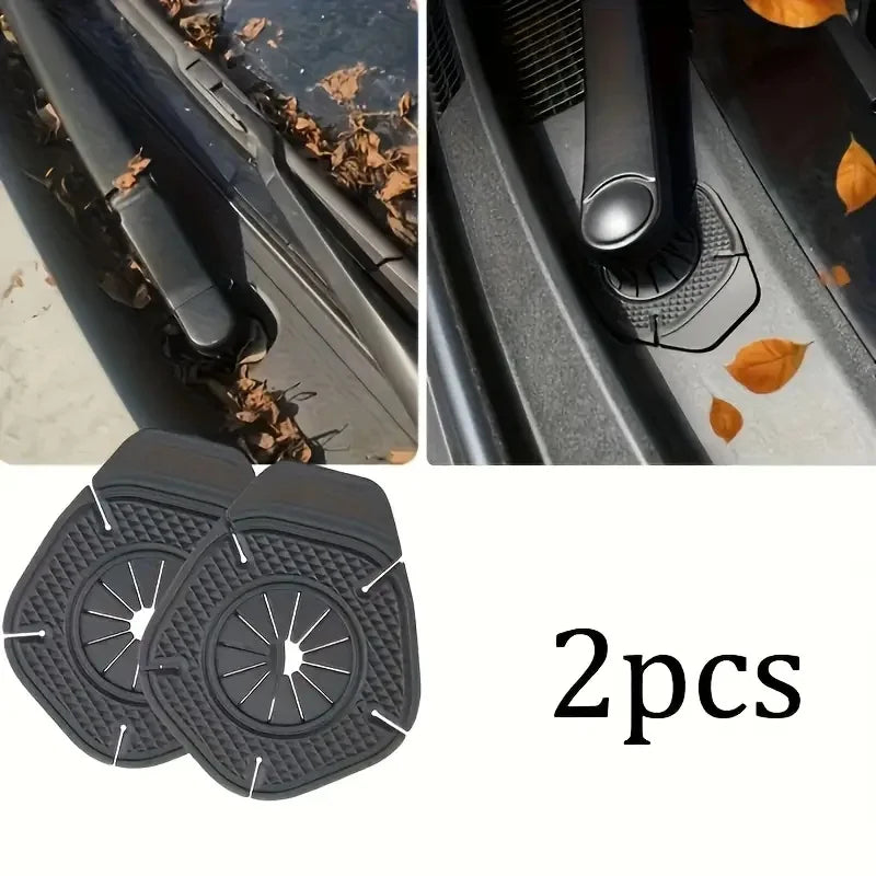 A pair of black anti-leak dust protectors designed to cover wiper arm holes on a vehicle.