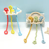 A set of silicone bear teethers with textured pull strings in red, yellow, and blue colors.