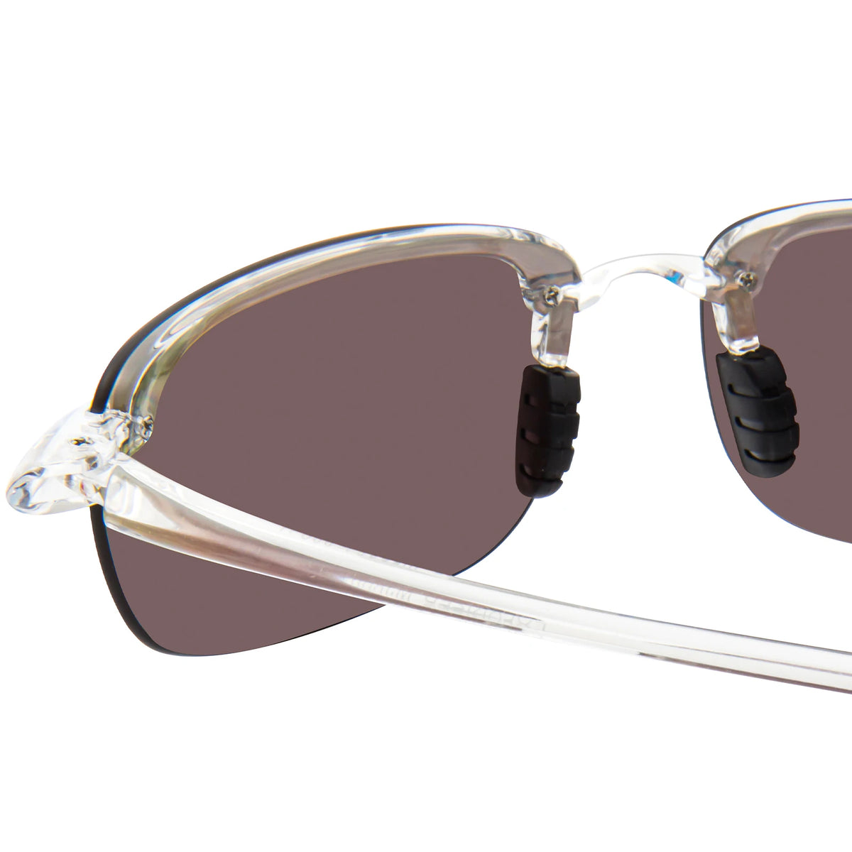 Rimless polarized sports sunglasses with a translucent frame and dark brown lenses