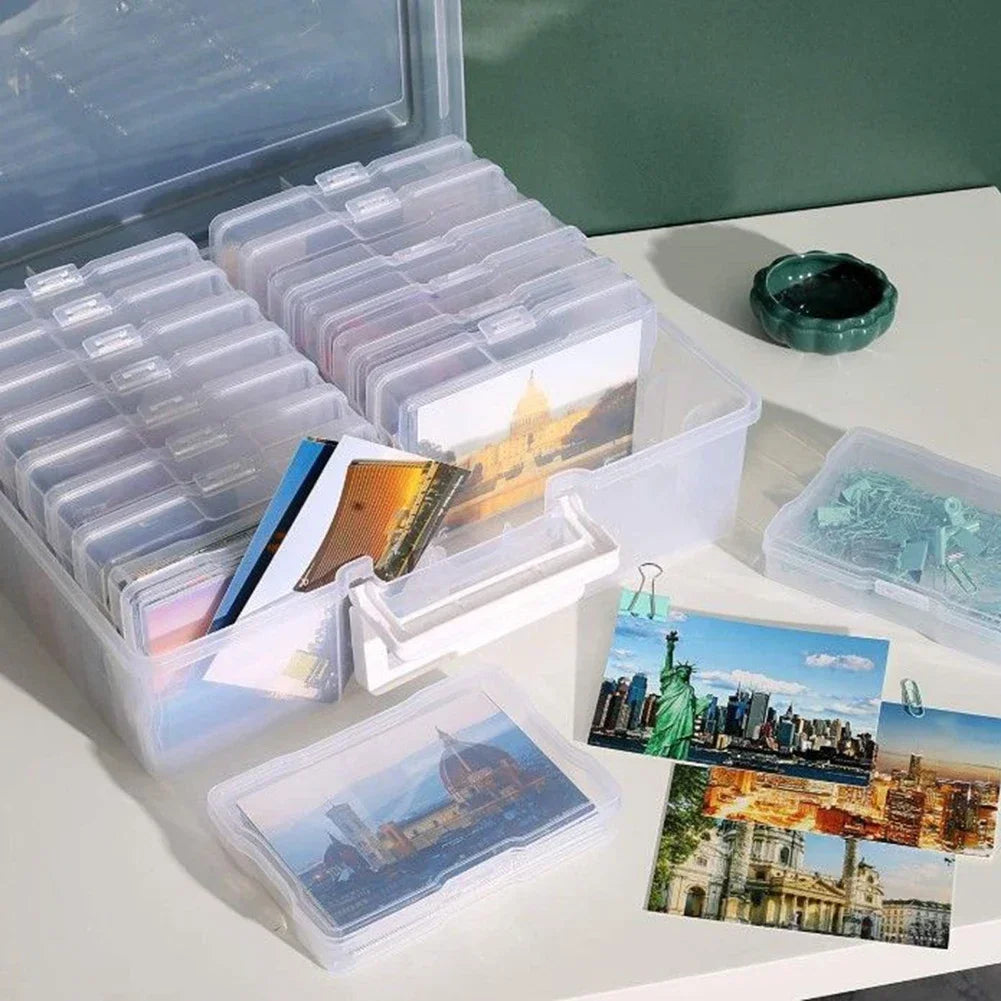 Clear plastic storage boxes filled with 4x6 photos and prints.