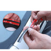 A hand is installing a red rubber sealing strip onto an automotive panel, demonstrating noise and weather protection.