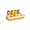 A yellow and orange interactive pop-up animal sensory toy with multiple colorful plastic figures.
