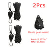 Two black plastic gear models for a heavy-duty camping rope tightener with ratchet lock.