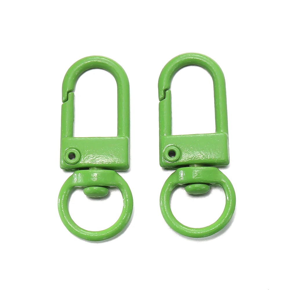 A pair of bright green alloy lobster clasp hooks for DIY jewelry making.