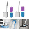 A set of wall-mounted toilet brushes in purple and blue, showing the brush and disposable heads being used for cleaning.