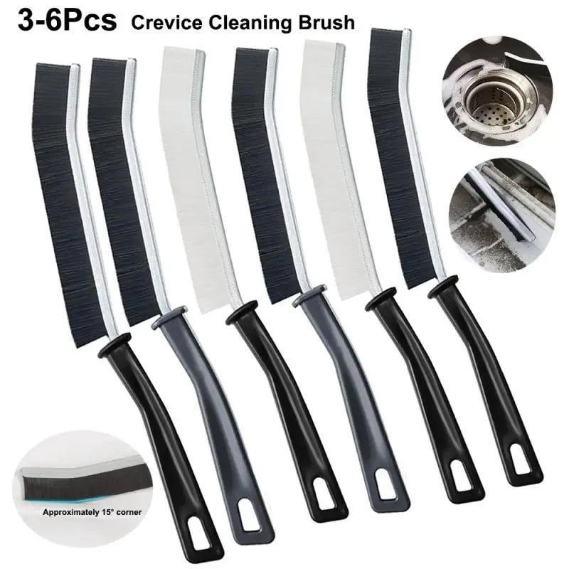 A set of six black and white crevice cleaning brushes for tight spaces, including a cleaning brush head.