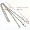 Silver metal chain strap with a bead and buckle, shown next to a cream-colored leather item.