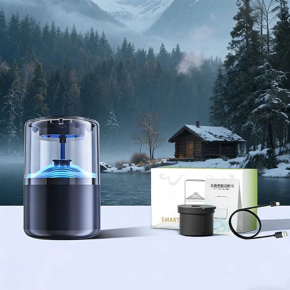 A black smart car diffuser with ambient blue light is shown on a white surface in a snowy forest landscape.