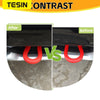 Comparison of a front bumper tow hook cover before and after installation.