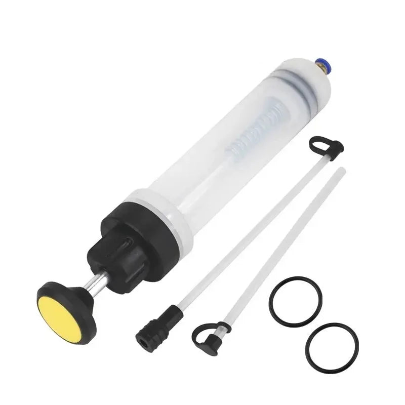 A white manual oil extractor pump with a black base and clear tubing is shown for fluid transfer.
