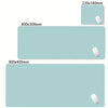 A set of oversized non-slip desk mats in a light blue color, shown in various sizes.