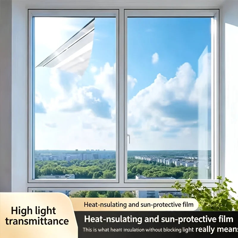 A window with a light-colored film installed, showing a bright blue sky and distant cityscape.
