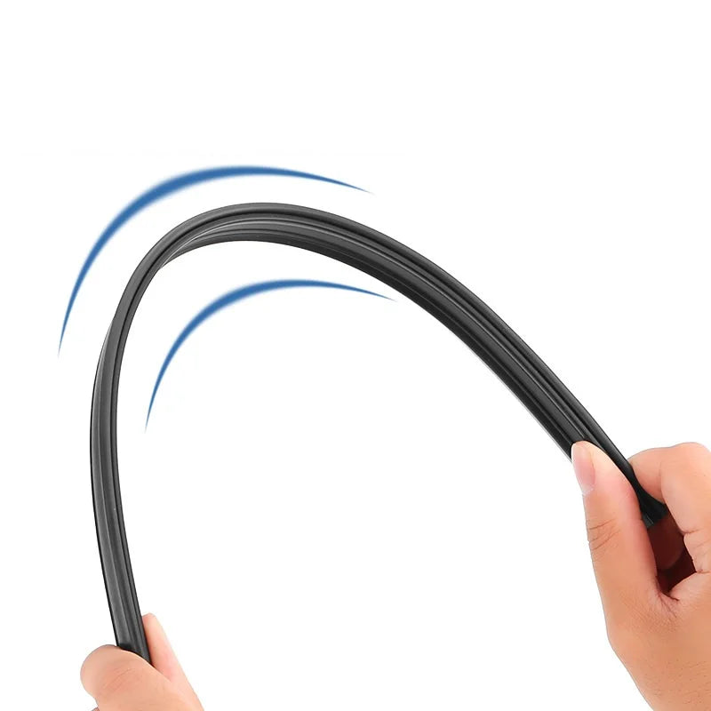 A hand is holding a black car side window wiper strip, demonstrating its curved shape for clear vision.