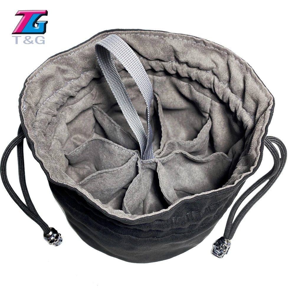 A gray velvet dice storage pouch with a drawstring and black cord is shown from above.