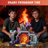 Two boys play with a magnetic building blocks set depicting a forest scene and house structure.