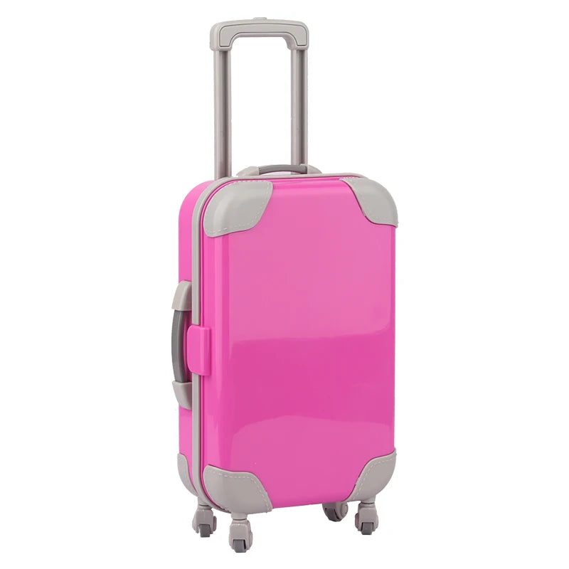 A pink and gray doll travel suitcase with a handle and wheels.
