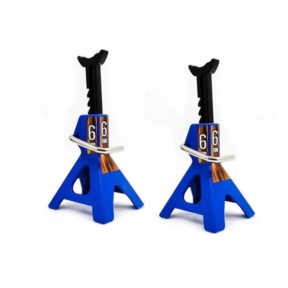 A pair of blue metal RC jack stands with black handles and gold accents.