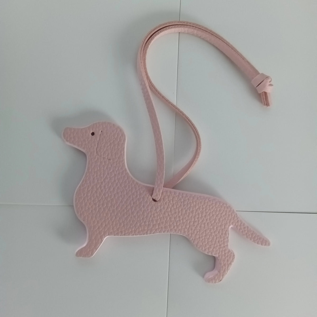 Pink PU leather dachshund and bulldog keychain with a pink strap