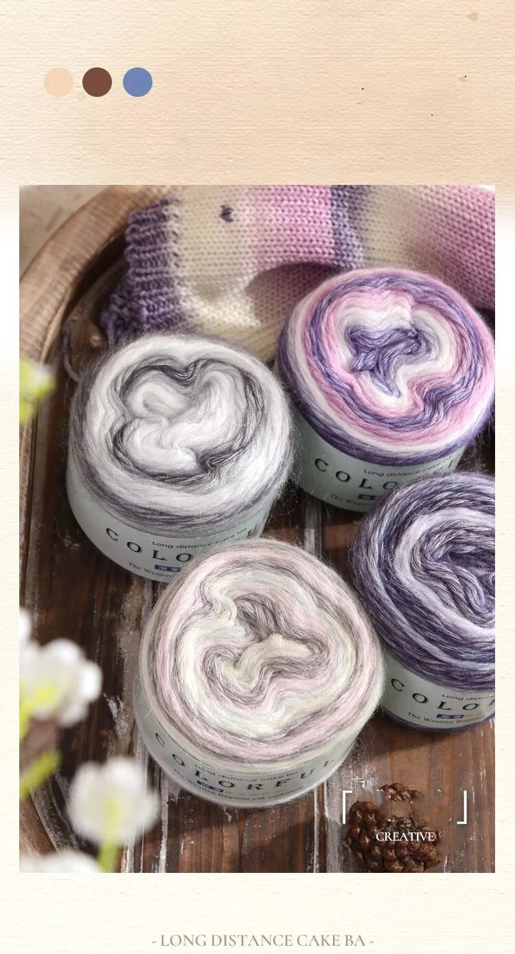 Rolls of soft, colorful wool-blend yarn in shades of pink and purple for knitting and crochet projects.