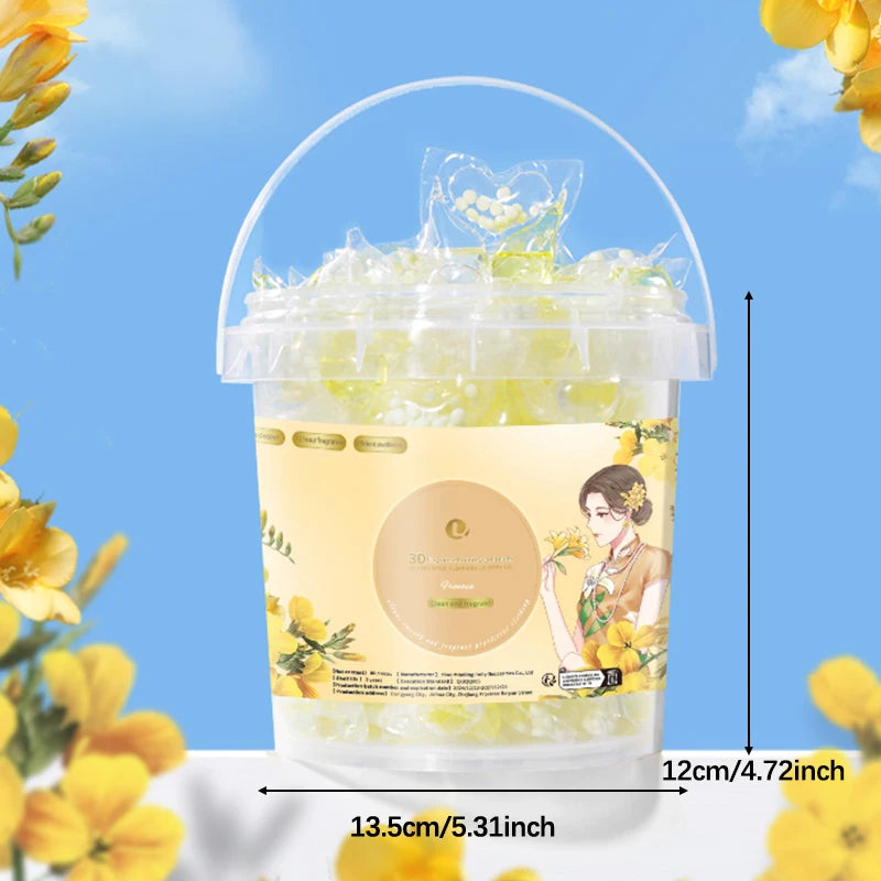 A clear plastic container filled with yellow laundry pods and water, labeled for stain and odor removal.