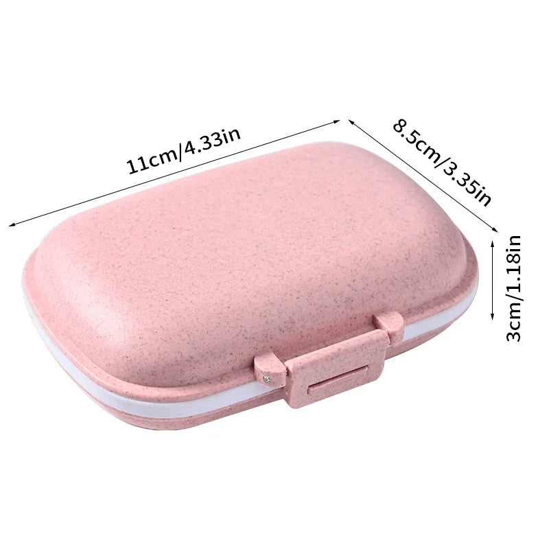 A pink weekly pill organizer with eight compartments shown from the top view.