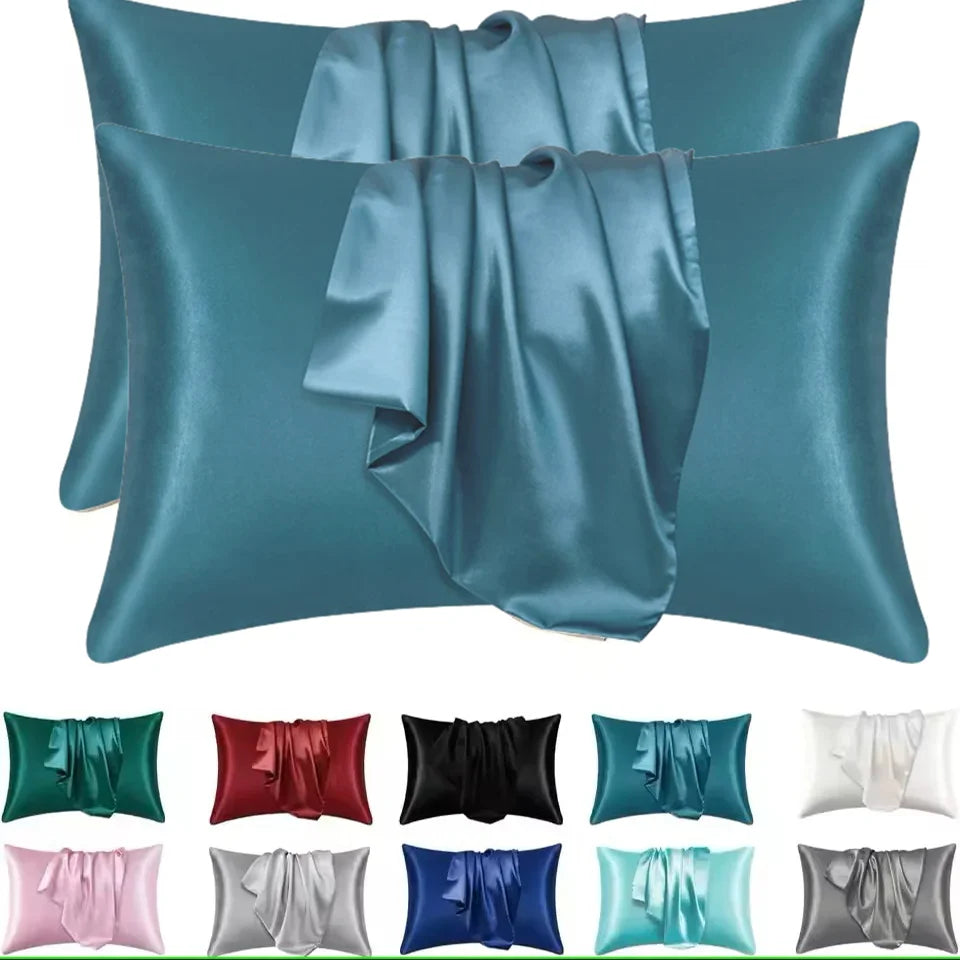A collection of silky smooth satin pillowcases in various shades including teal, blue, green, pink, and gray.