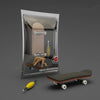 A wooden finger skateboard is displayed in its packaging, alongside the skateboard itself.
