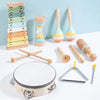 A set of wooden percussion instruments including maracas, mallets, and a large wooden cymbal/gong.