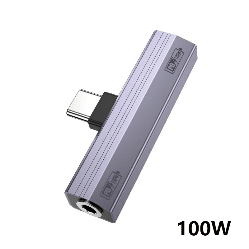 A silver USB-C to 3.5mm audio adapter with charging support shown in a diagonal view.