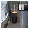 A black bamboo bathroom organizer set with a soap dispenser is shown on a gray tiled floor.