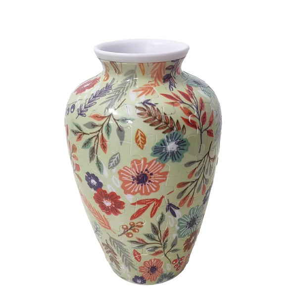 A ceramic vase with a pale green glaze decorated with floral patterns in shades of pink, red, and blue.