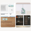 Close-up view of child safety cabinet locks for drawers and refrigerator, showing various lock mechanisms and installation in
