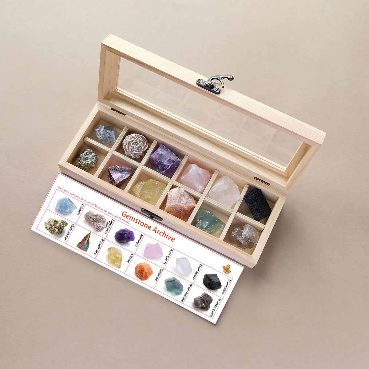 A wooden gift box containing twelve natural gemstone crystal stones arranged in compartments.