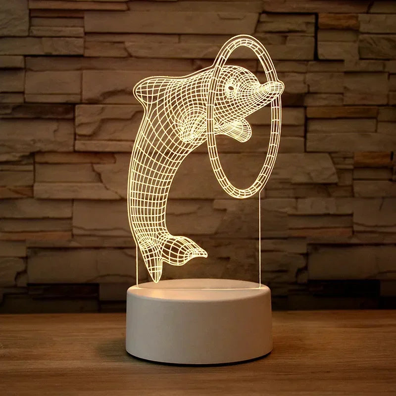 A glowing wireframe 3D illusion night light lamp shaped like a dolphin resting on a wooden surface.