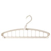 A white multi-layer space-saving closet organizer hanger with a hook.