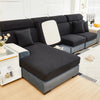 A dark gray elegant jacquard sofa slipcover with an elastic fit displayed indoors.